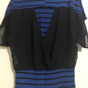 Blue/black striped opened back shirt.